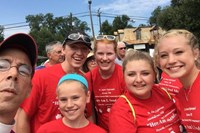 Diocese of Mississippi Bishop Brian Seage poses with some youth group members from St. James Episcopal Church in Keene, New Hampshire. The parish sponsored Jonathan Daniels for ordination.