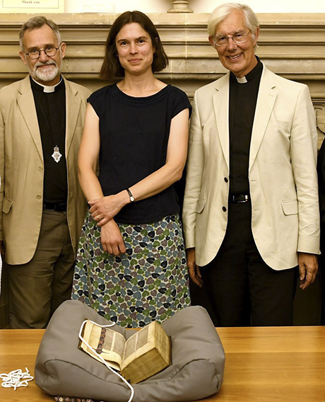 The Lyghfield Bible returns to Canterbury Cathedral much to the delight of (left to right) Canon Librarian, Revd Tim Naish, Head of Archives and Library Mrs Cressida Williams and the Dean of Canterbury, the Very Revd Robert Willis.