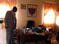 Headmaster _Philip _surveying _the _destruction _to _his _office